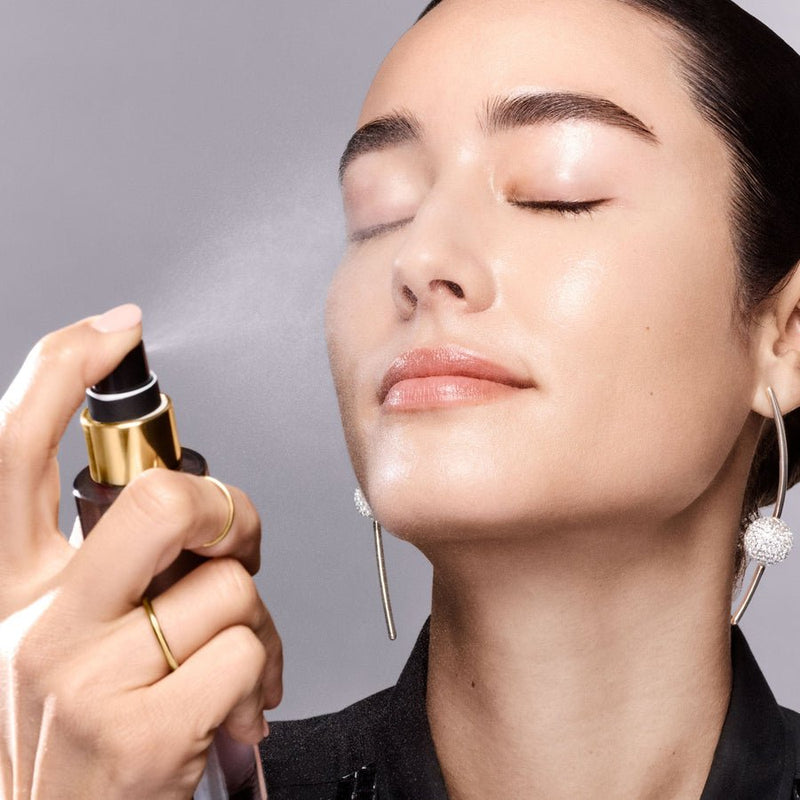 Bobbi Brown Intensive Serum Radiance Mist being sprayed on face