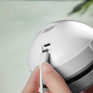 USB desk cleaner in use on keyboard